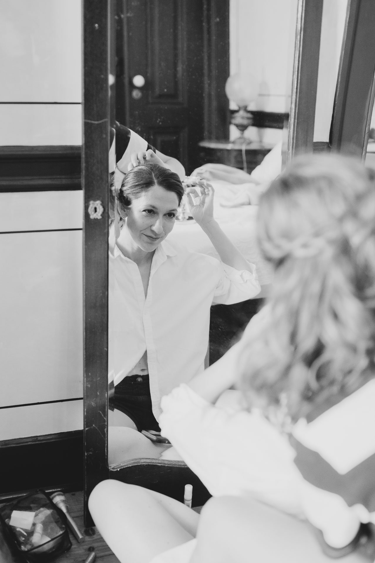 Bride bursting into laughter while getting ready for her intimate Lisbon micro-wedding.