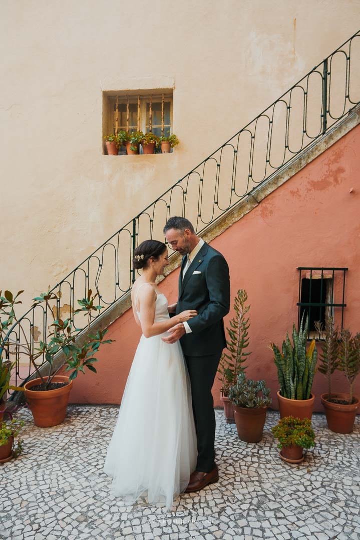 Bride and groom exchanging vows on a terrace in Alfama, the heart of Lisbon, during their intimate micro-wedding.