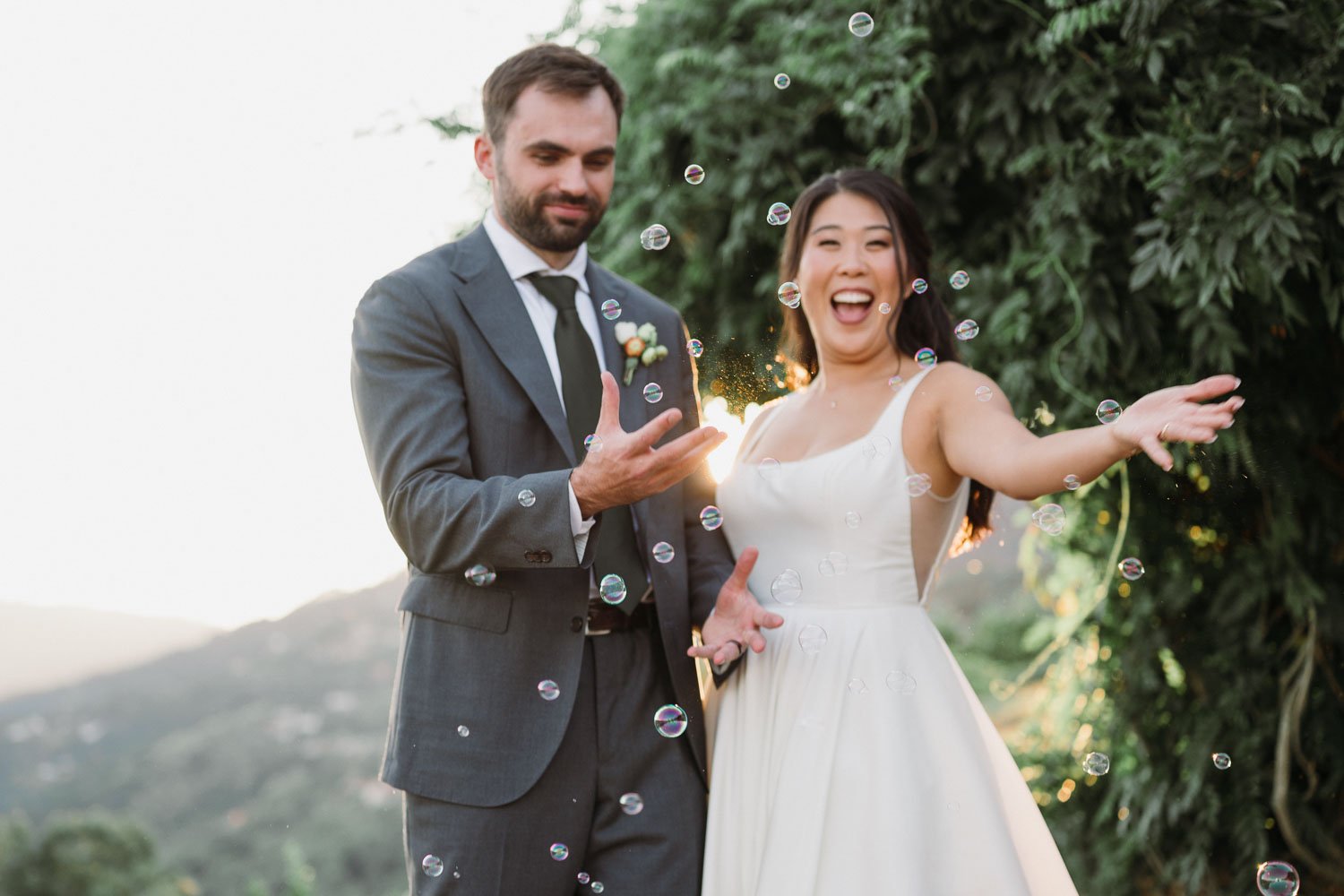 Bride and groom laughing during a playful golden hour portrait session overlooking the Douro Valley