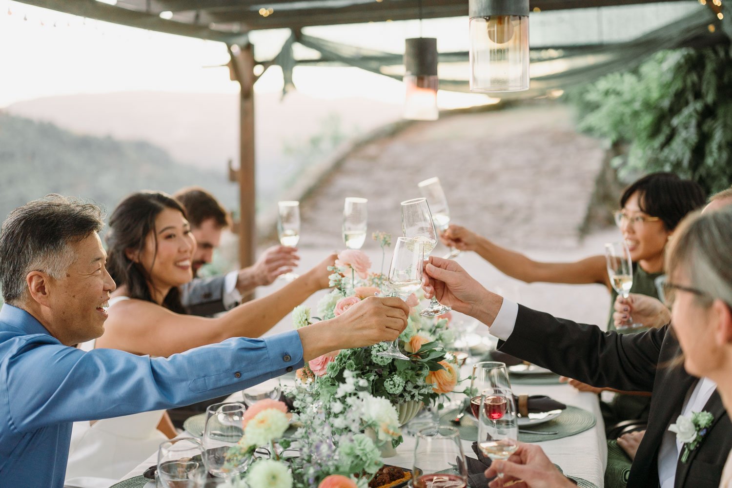 Family toasting during an intimate wedding dinner with private chef in the Douro Valley