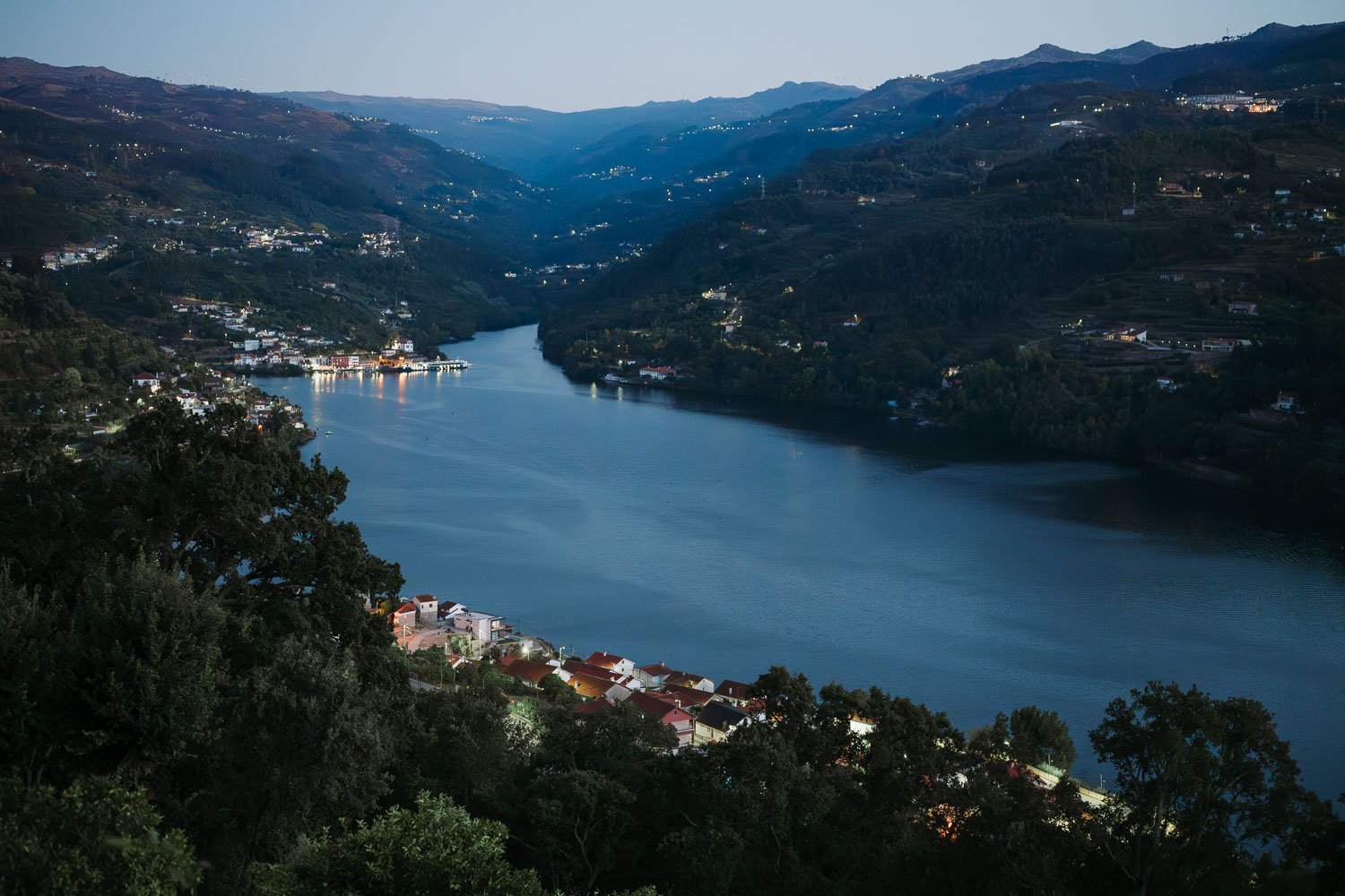 Evening light fading over the Douro Valley vineyards and river in Northern Portugal
