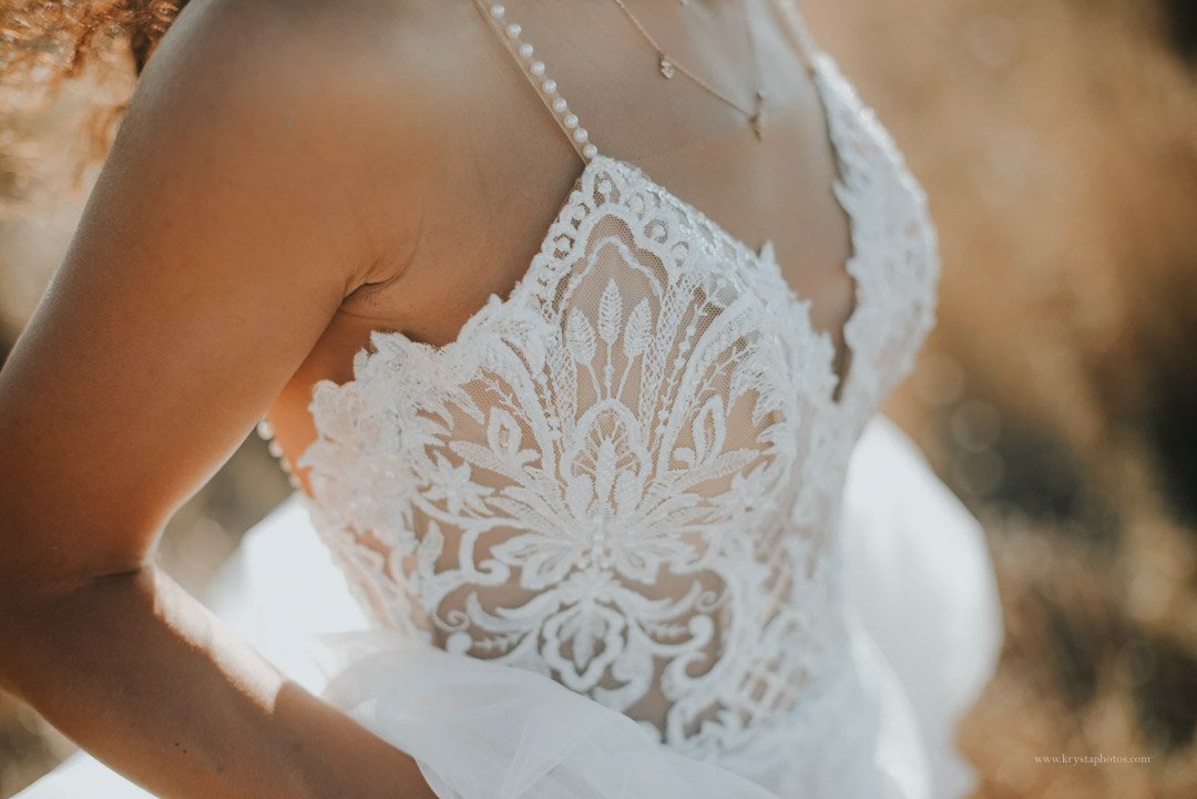 Detail shot of lace Pronovias wedding dress on bride in Greece
