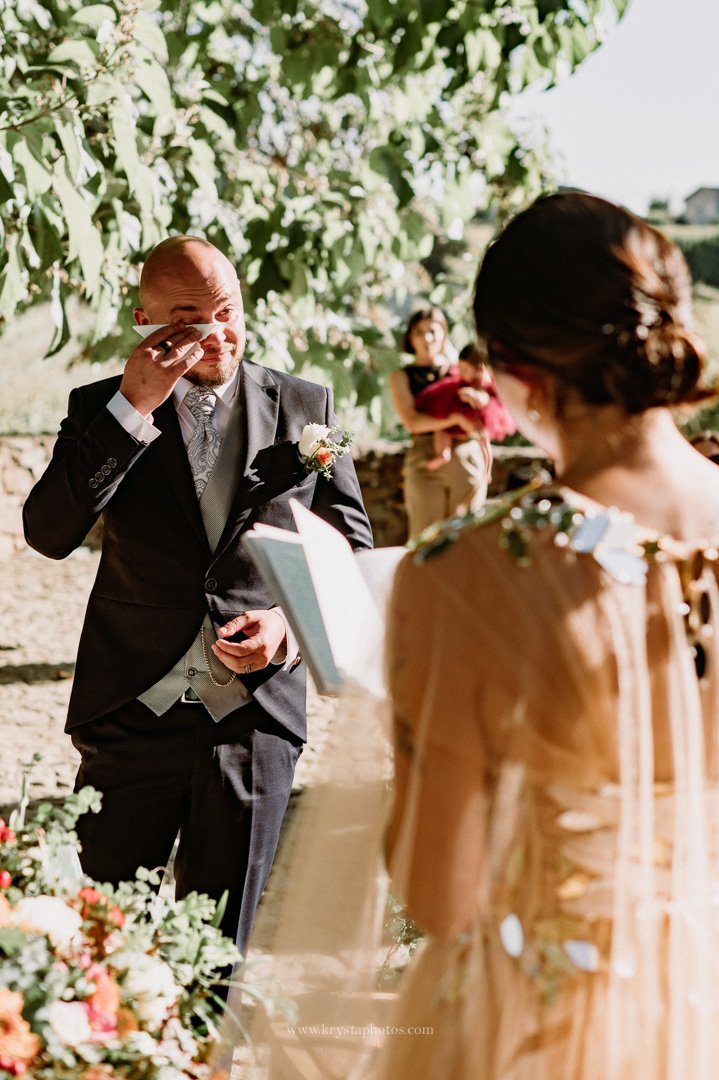 Bride and groom exchange emotional vows during whimsical vineyard wedding reception in Portugal