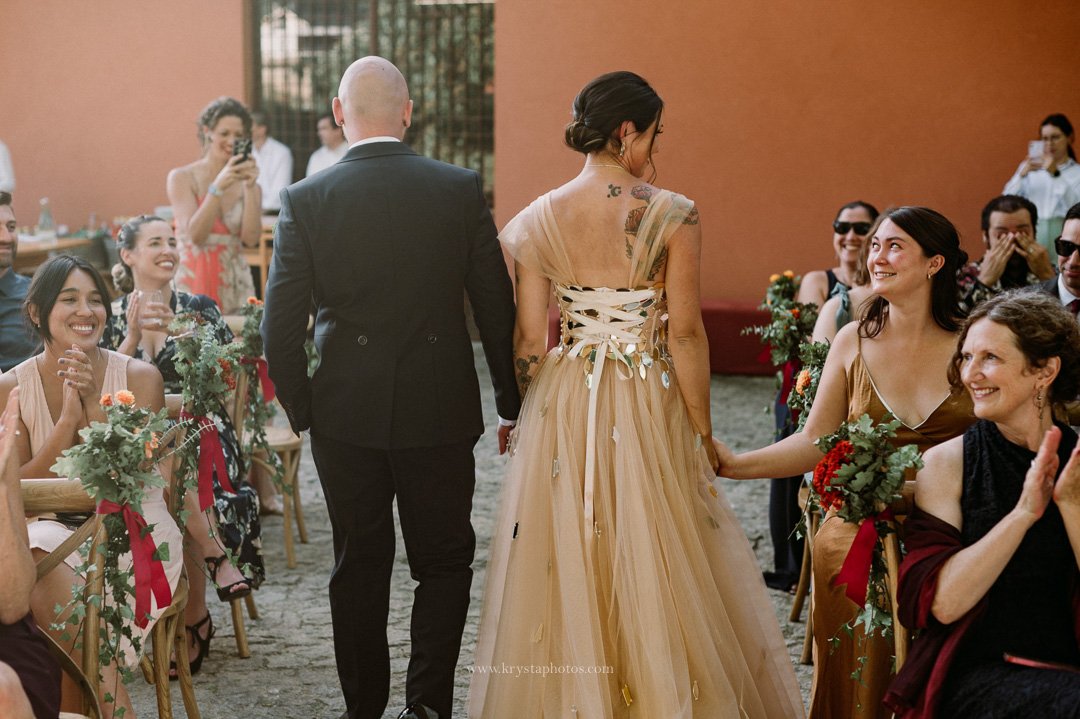 Bride and groom exchange emotional vows during whimsical vineyard wedding reception in Portugal