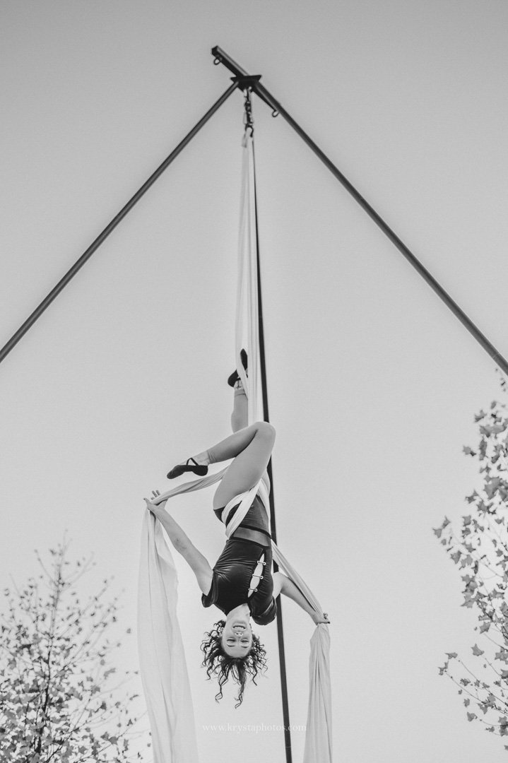 Couple performing aerial circus act after whimsical vineyard wedding reception in Portugal