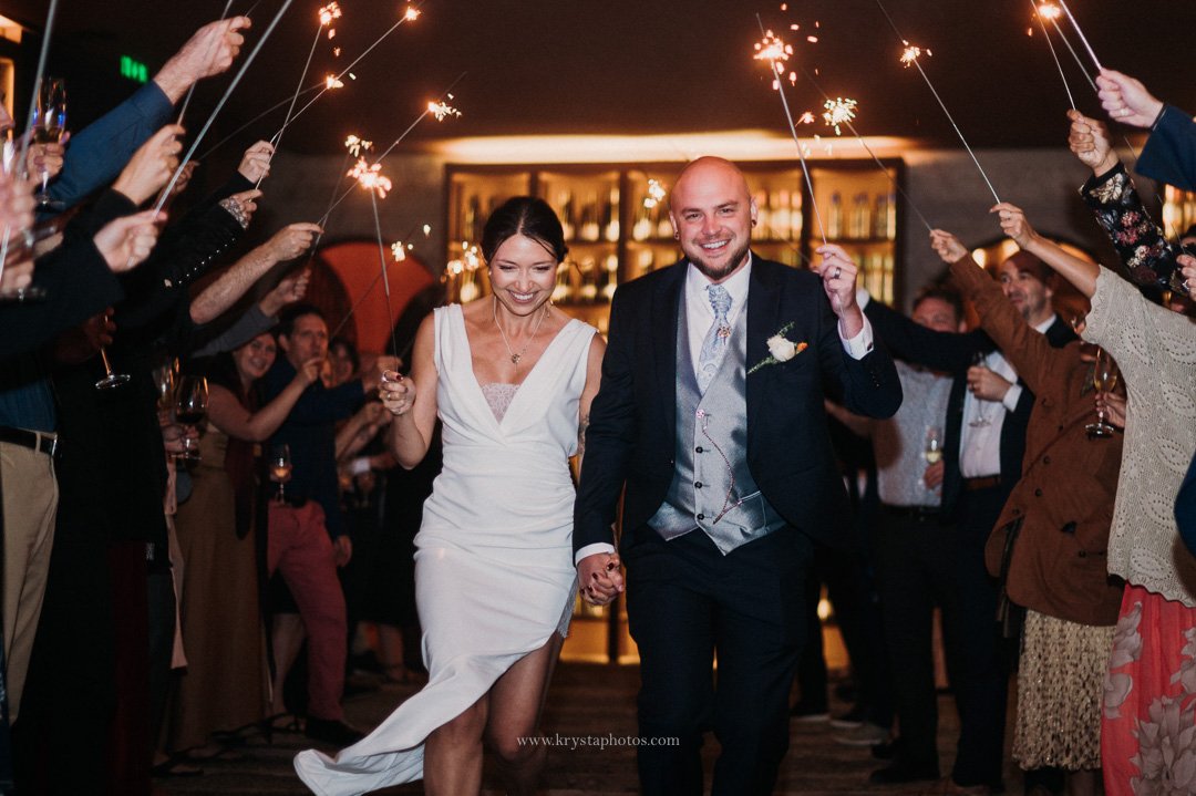 Bride and groom’s magical sparkler exit at whimsical vineyard wedding in Portugal