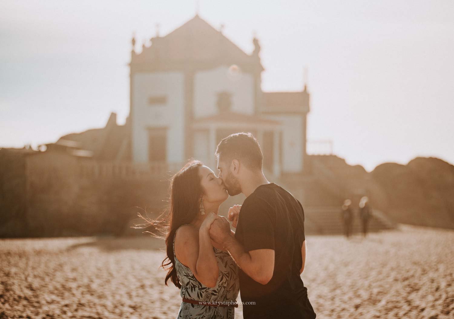 couple photoshoot at Senhor da Pedra Miramar during golden hour with ocean and chapel