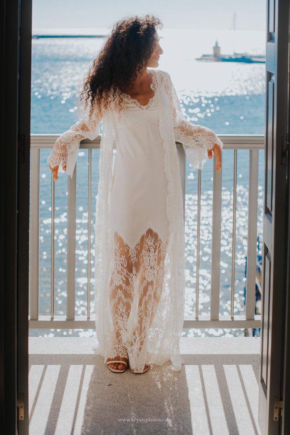Bride wearing long lace robe during bride preparation for wedding, elegant bridal prep outfit inspiration