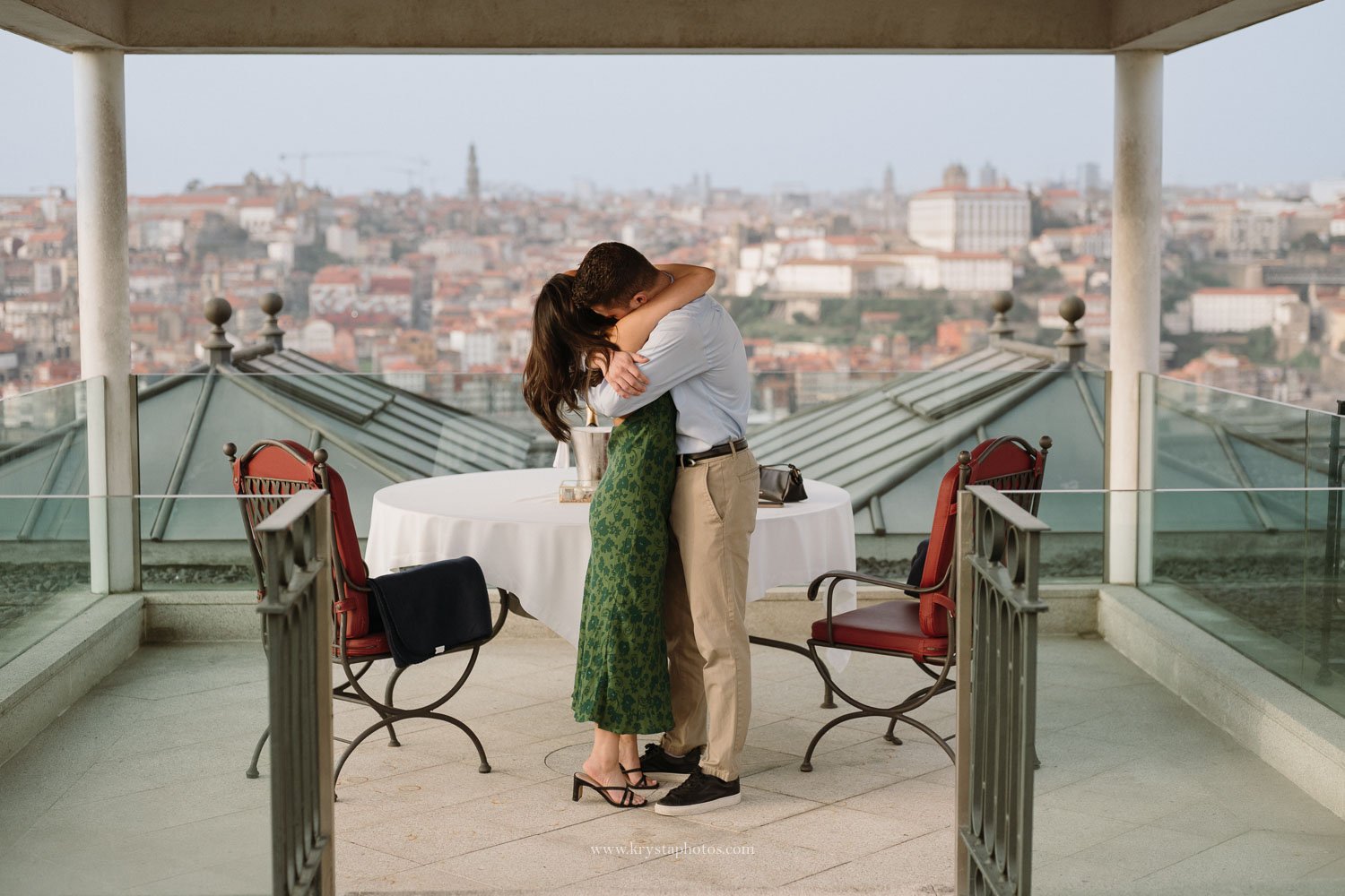 Couple embracing after a romantic marriage proposal at The Yeatman Porto overlooking the city skyline