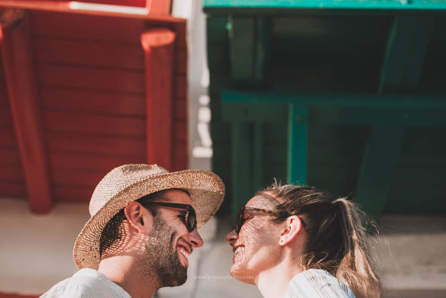 Happy couple smiling at each other on a sunny summer day in the Greek islands on their honeymoon