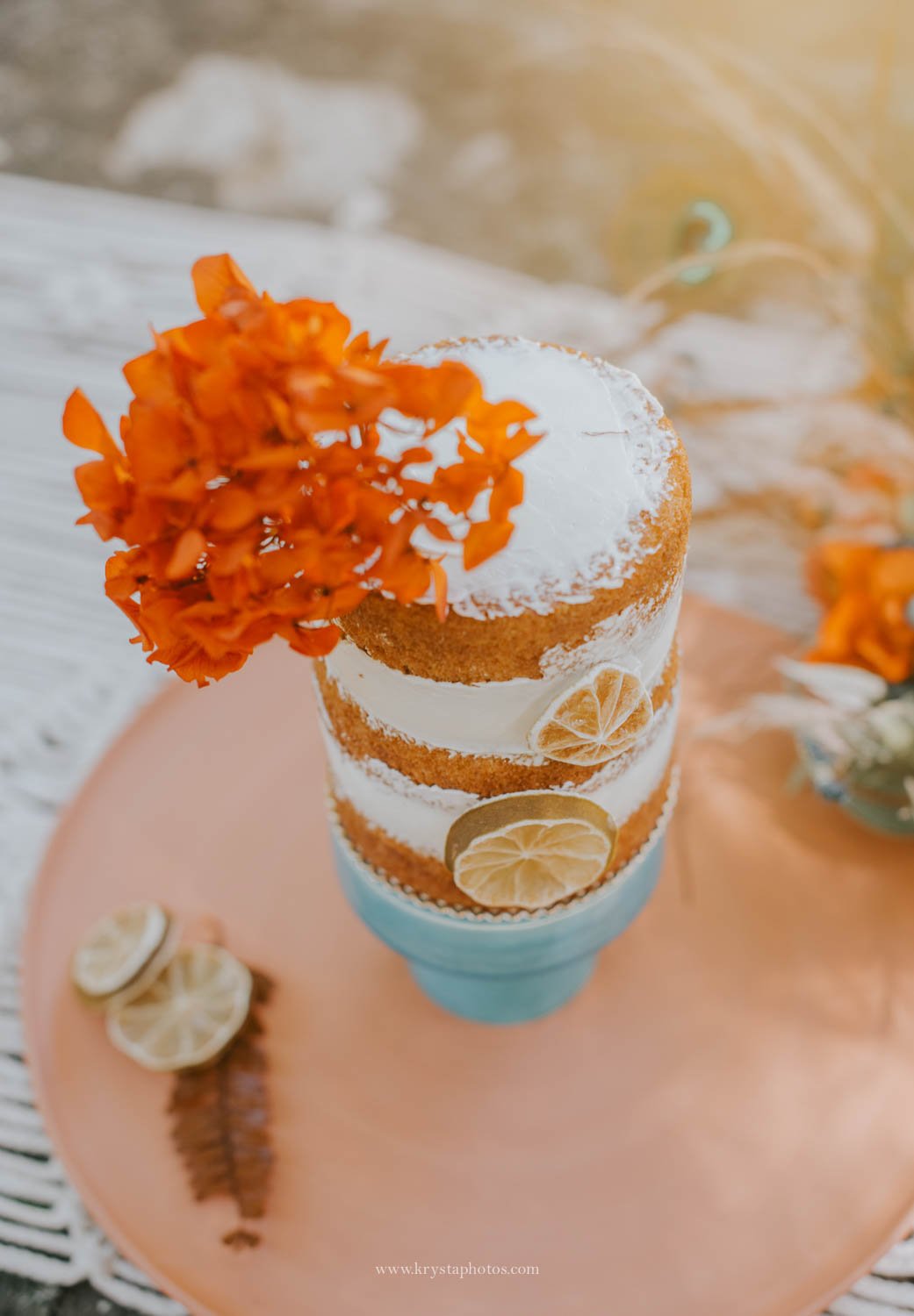 Boho chic mini wedding cake with citrus decoration from creative wedding editorial photographed in Portugal