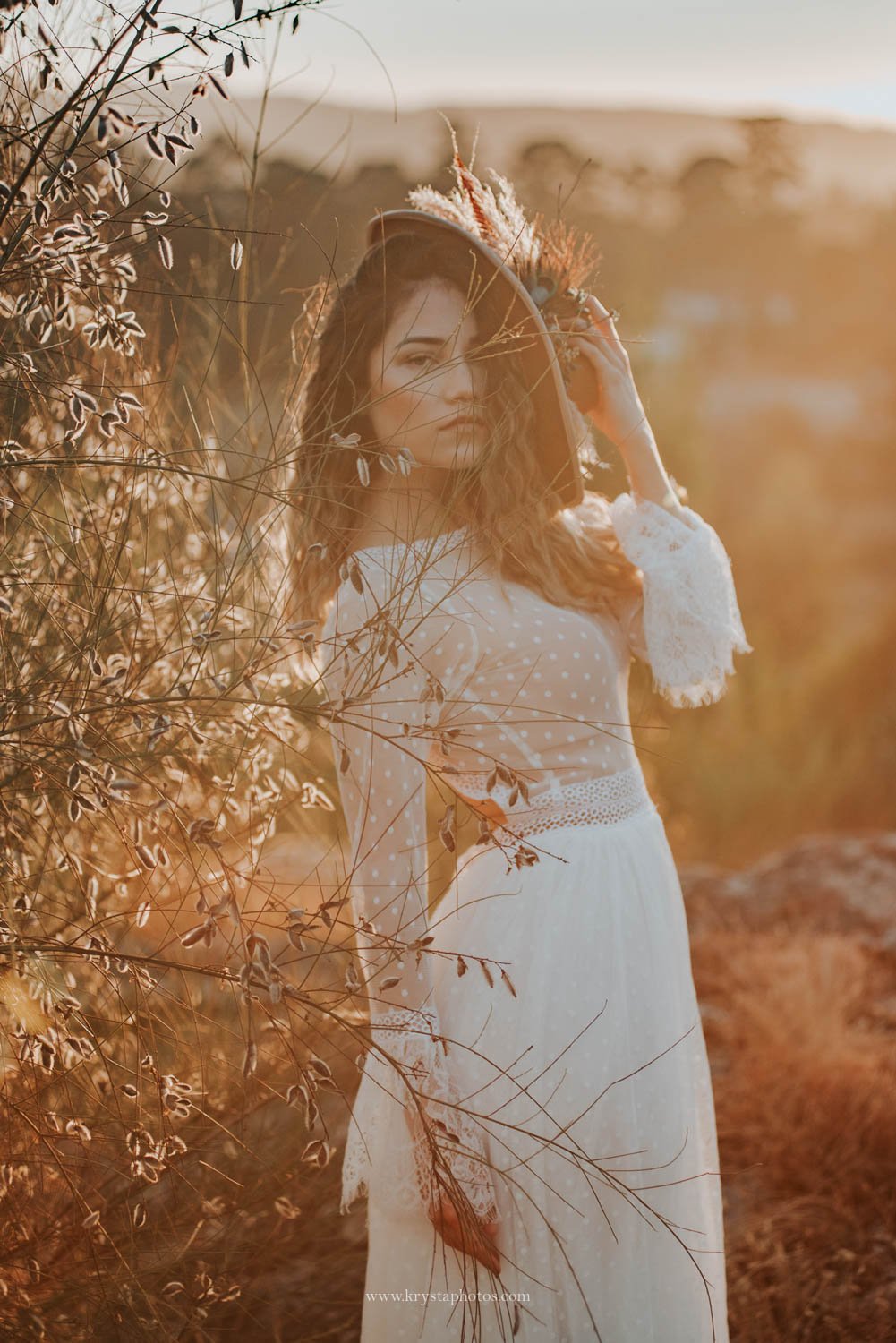 Boho chic bridal portrait in natural light during creative wedding editorial photographed in Portugal<br />
