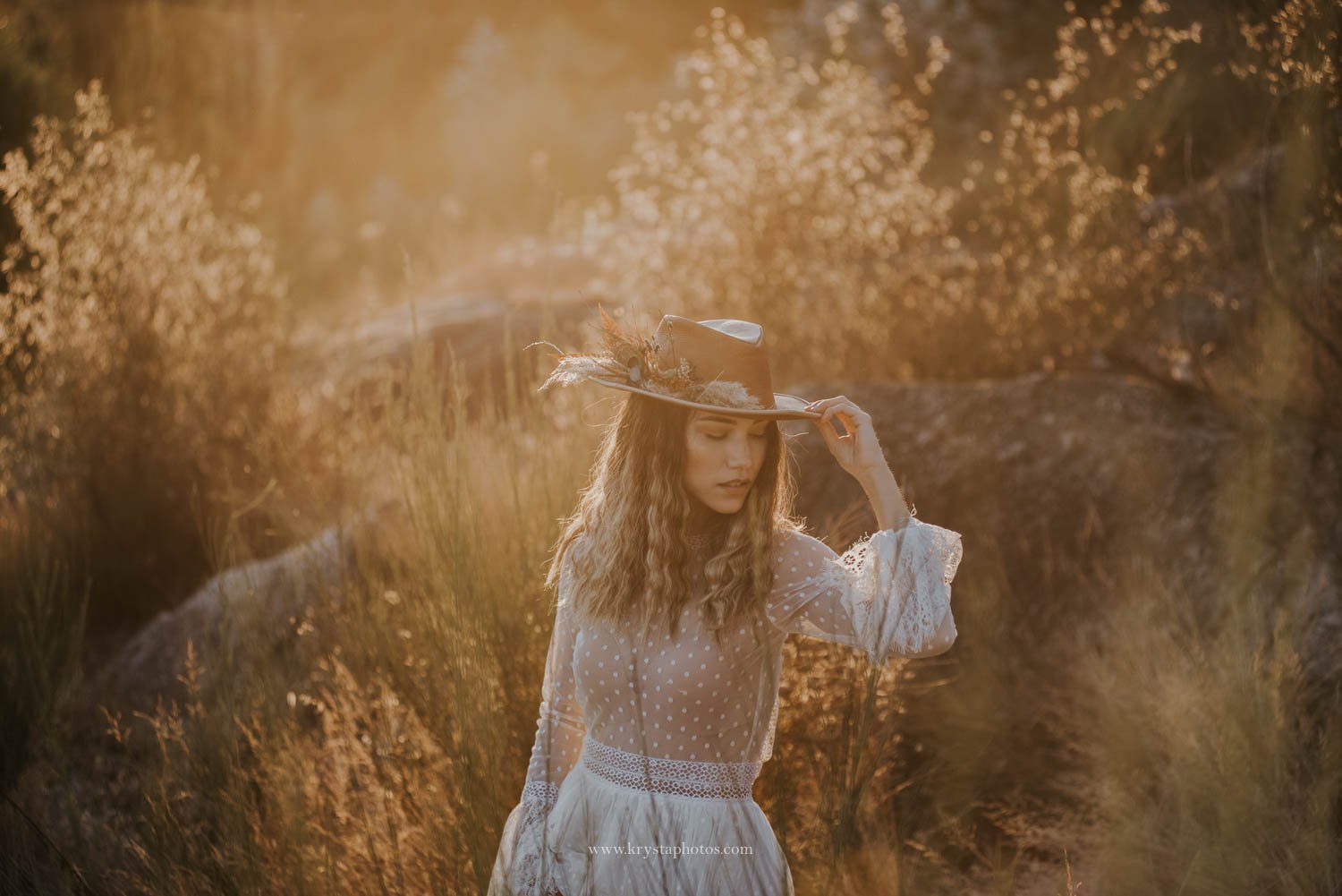 Boho chic bridal portrait at golden hour in natural light during wedding editorial photographed in Portugal