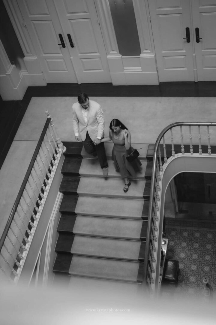 Well-dressed couple during Porto engagement photoshoot, iconic Porto streets and monuments, elegant dress and Prada bag, polished groom