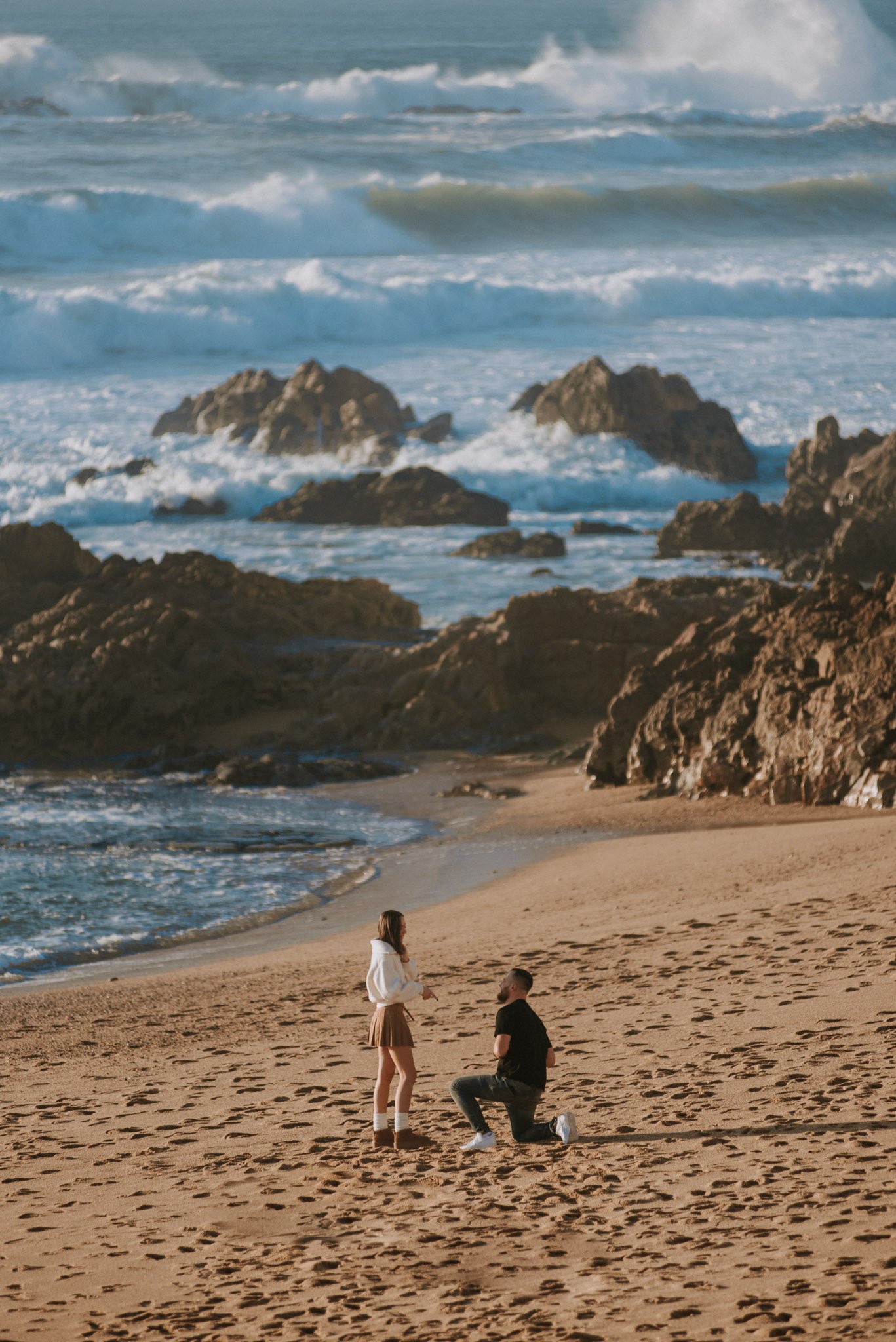 couple photoshoot at Foz do Douro lighthouse Porto with ocean and sunset light