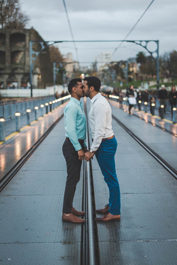 gay couple engagement photos on Dom Luís I Bridge Porto with Douro river view