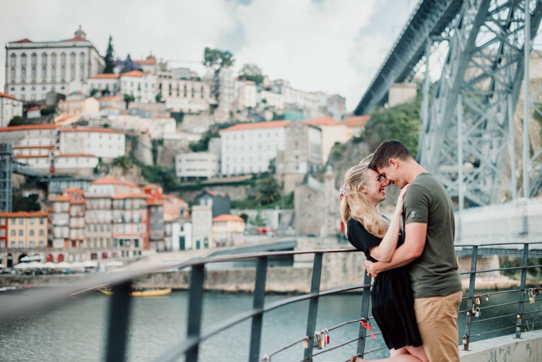 couple photoshoot in Porto Ribeira with Douro river view and historic downtown architecture