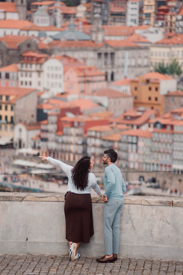 couple photoshoot in Porto Ribeira with Douro river view and historic downtown architecture
