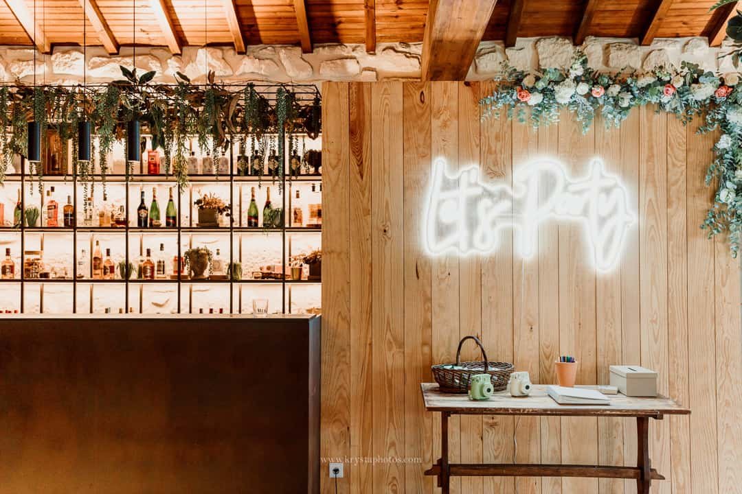 Rustic indoor wedding reception at Quinta do Avesso with stone walls, walnut wood ceiling, and romantic details