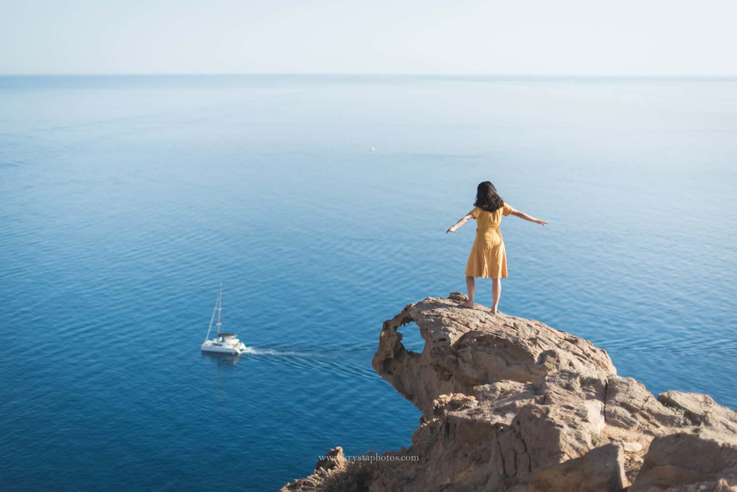 Minimal whitewashed stairs against a blue sky in Santorini, Greece<br />
