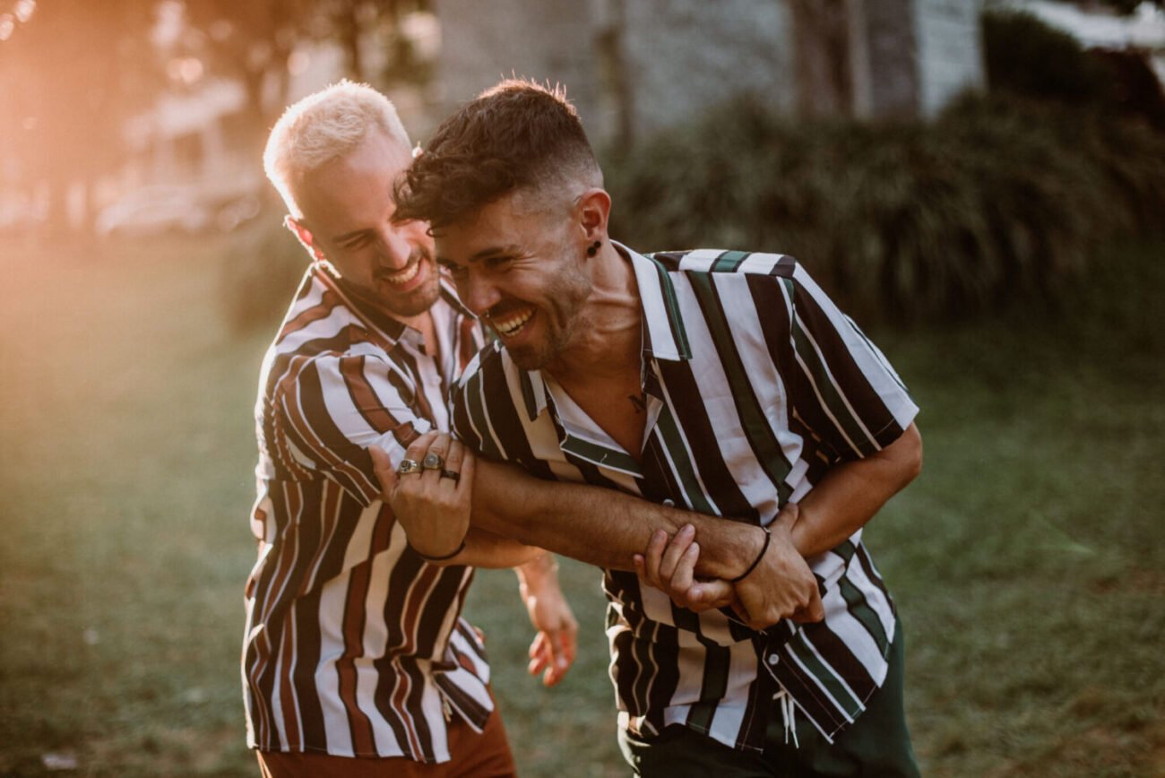 Engaged gay couple at sunset in Porto
