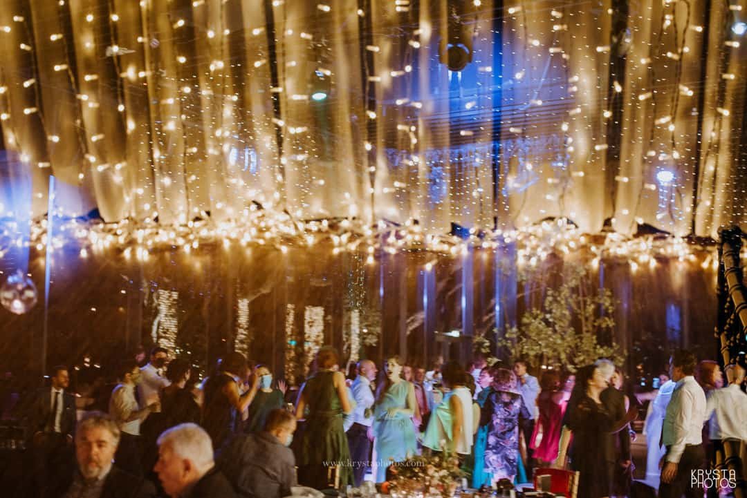 Couple strolling the narrow streets of Lemnos island, Greece being completely relaxed and enjoying summer holidays together.