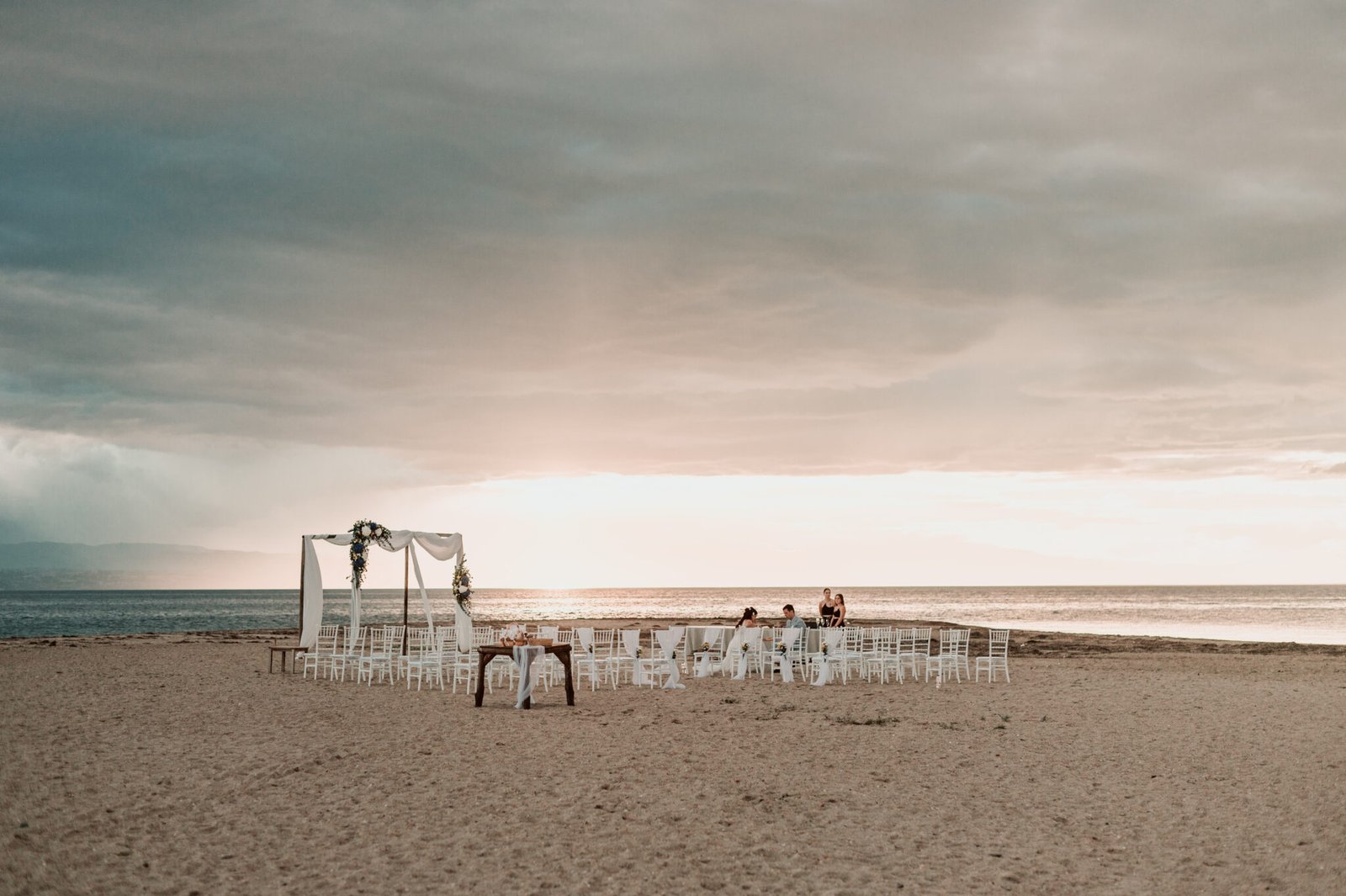 Greece destination beach wedding ceremony at sunset