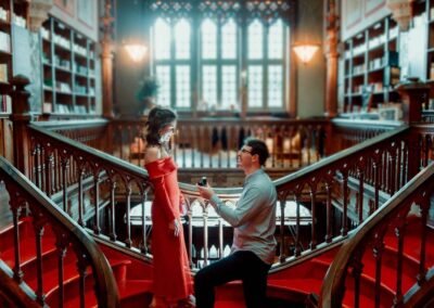 Surprise proposal at Livraria Lello in Porto on the iconic red staircase
