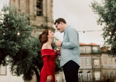 romantic engagement photos in Porto with Clérigos Tower in historic city center